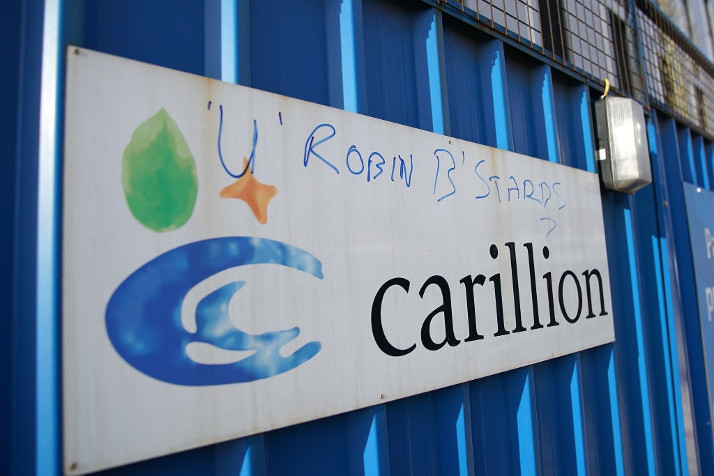 Defaced branding is seen outside Carillion's Royal Liverpool Hospital site which is being built by Carillion in 2018. The company went into liquidation and thousands of jobs were lost. Its audit and auditors are subject to investigations by the FRC  (Photo by Christopher Furlong/Getty Images)