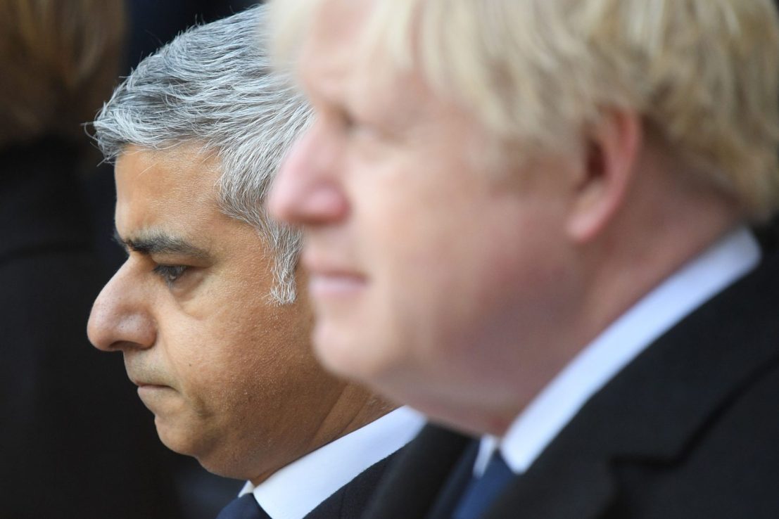 London mayor Sadiq Khan (L) and Britain's Prime Minister Boris Johnson take part in a vigil at the Guildhall in central London to pay tribute to the victims of the London Bridge terror attack on December 2, 2019. (Photo by DANIEL LEAL-OLIVAS / AFP) (Photo by DANIEL LEAL-OLIVAS/AFP via Getty Images)