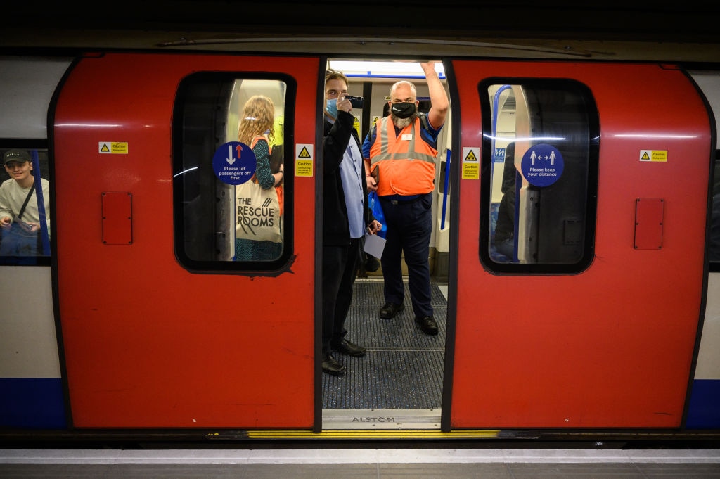 Public transport enthusiasts and staff members wait on one of the first train departing from Battersea Power Station underground station as it opens for the very first time on September 20, 2021 in London (Photo by Leon Neal/Getty Images)