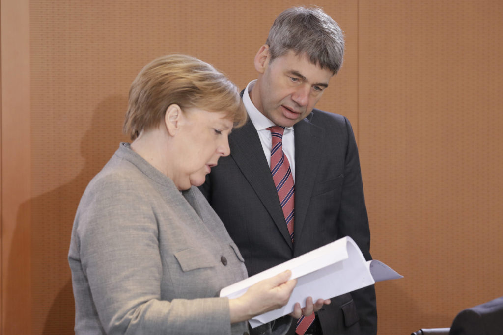 Angela Merkel, with Jan Hecker earlier this year in Berlin (Source: Table Media)