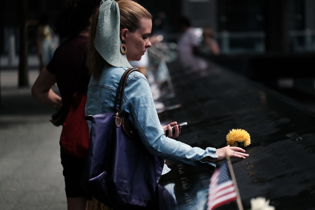 A woman mourns a relative at the September 11 Memorial at Ground Zero on August 31, 2021 in New York City. (Photo by Spencer Platt/Getty Images)