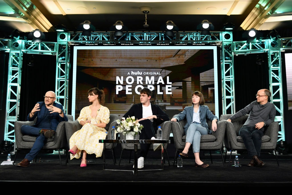 (L-R) Lenny Abrahamson, Daisy Edgar-Jones, Paul Mescal, Sally Rooney, and Ed Guiney of "Normal People" speak on stage during a tour of the US (Photo by Amy Sussman/Getty Images)