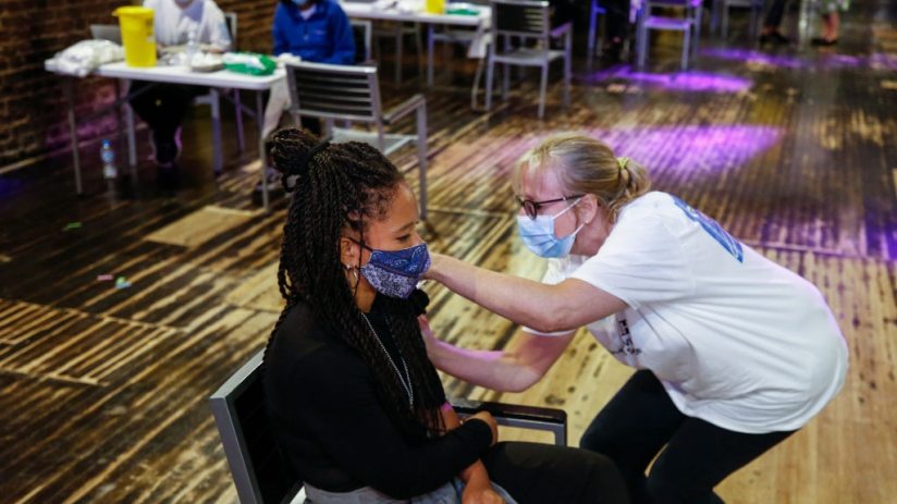 Women receives Pfizer vaccine