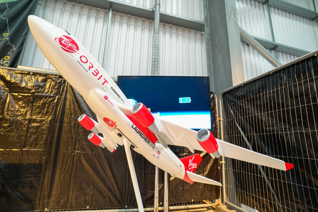 A model of Virgin Orbit's Cosmic Girl is displayed on the opening day of the Story of a Satellite summer exhibition at Spaceport Cornwall (Photo by Hugh Hastings/Getty Images)