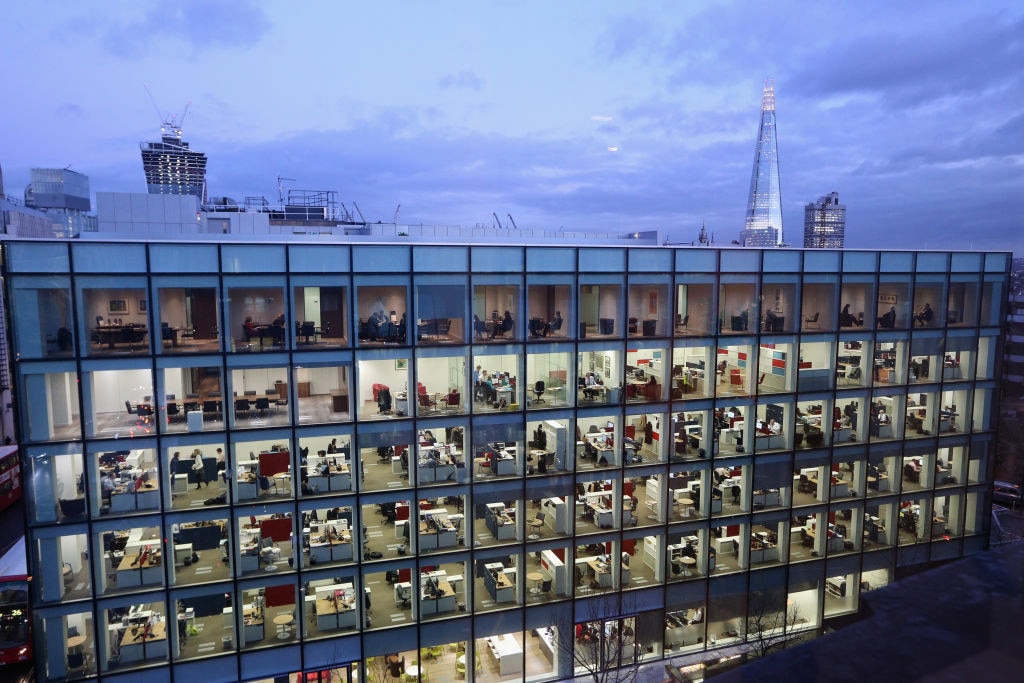 Workers in offices at night in London