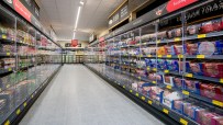 Aldi supermarket chiller doors showcasing chilled products, amid competition scrutiny by Sainsbury&rsquo;s, Morrisons, and Ice...