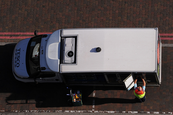 LONDON, ENGLAND - JULY 29: An elevated view of a Tesco delivery van as a staff member selects shopping from inside the van on July 29, 2020 in London, England. (Photo by Alex Burstow/Getty Images)