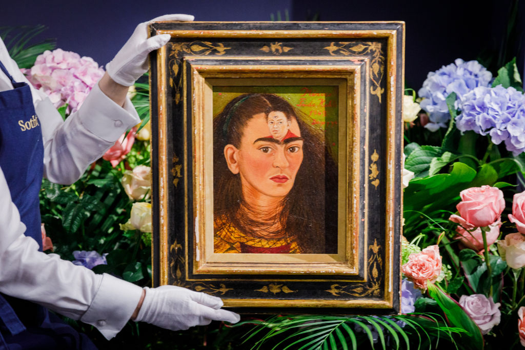 LONDON, ENGLAND - OCTOBER 21:  Frida Kahlo’s ultimate self-portrait goes on view at Sotheby's on October 21, 2021 in London, England. Estimated at over $30 million, it is expected to break the record for the artist and for any Latin American artist. This is a unique chance for British audiences to view a self-portrait by Kahlo, with none in UK institutions. The painting is on view to the public at Sotheby's London from the 22 -25 October ahead of being auctioned at Sotheby's New York on 16 November 2021.  (Photo by Tristan Fewings/Getty Images for Sotheby's)