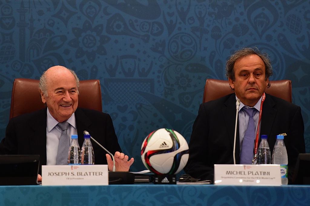 Blatter (left) authorised a payment to Platini (right) that prosecutors say was "without a legal basis"