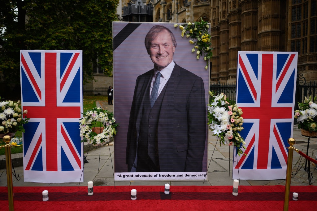 A large photograph of murdered MP David Amess is seen outside the Houses of Parliament on October 18, 2021 in London, England. (Photo by Leon Neal/Getty Images)