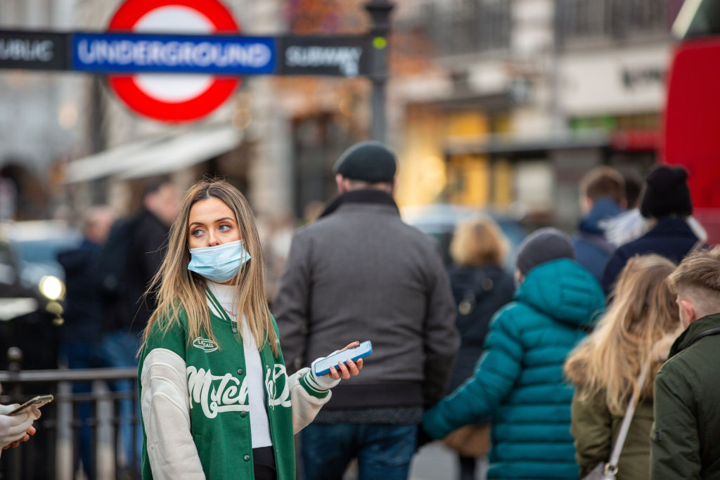 A shopper wearing a facemask as a preventive measure against