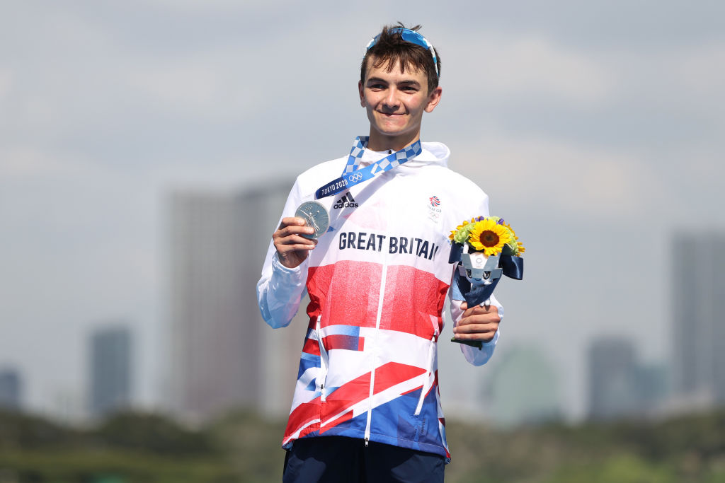 TOKYO, JAPAN - JULY 26: Alex Yee of Team Great Britain poses with the silver medal for the Men's Individual Triathlon on day three of the Tokyo 2020 Olympic Games at Odaiba Marine Park on July 26, 2021 in Tokyo, Japan. (Photo by Cameron Spencer/Getty Images)