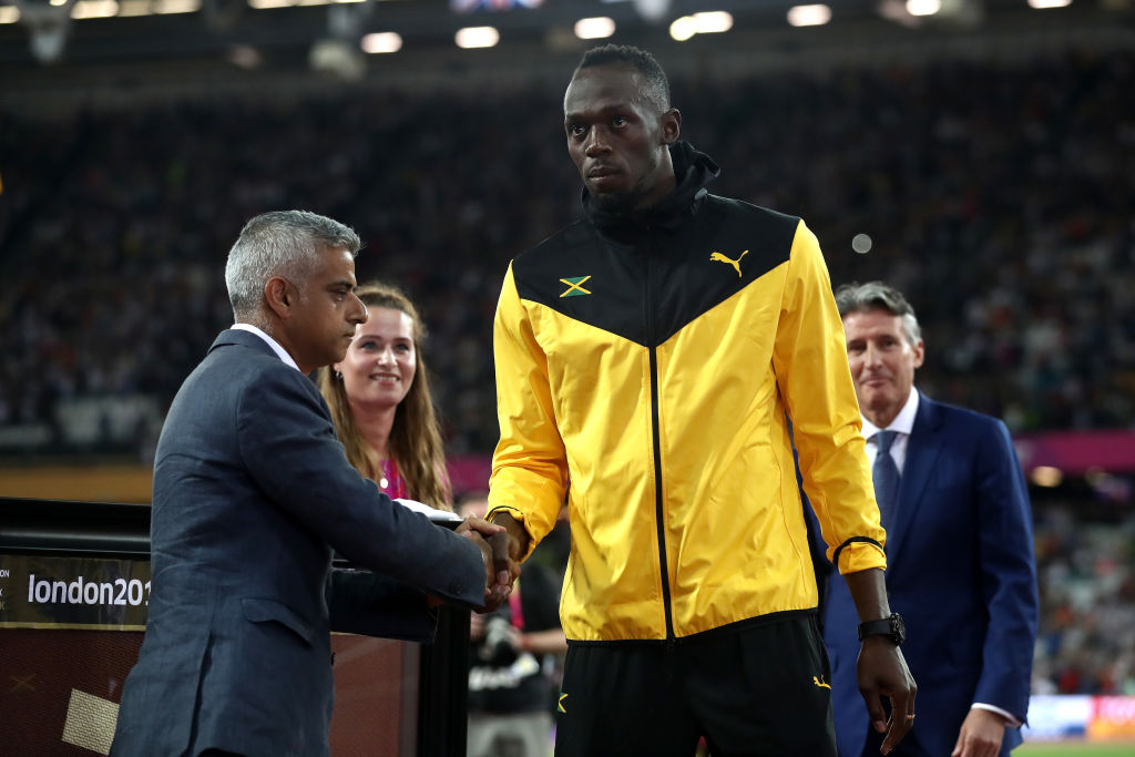 LONDON, ENGLAND - AUGUST 13:  Usain Bolt of Jamaica is presented with a framed piece of the track from the London 2012 Olympics IAAF President Sebastian Coe and Mayor of London Sadiq Khan during day ten of the 16th IAAF World Athletics Championships London 2017 at The London Stadium on August 13, 2017 in London, United Kingdom.  (Photo by Alexander Hassenstein/Getty Images for IAAF)