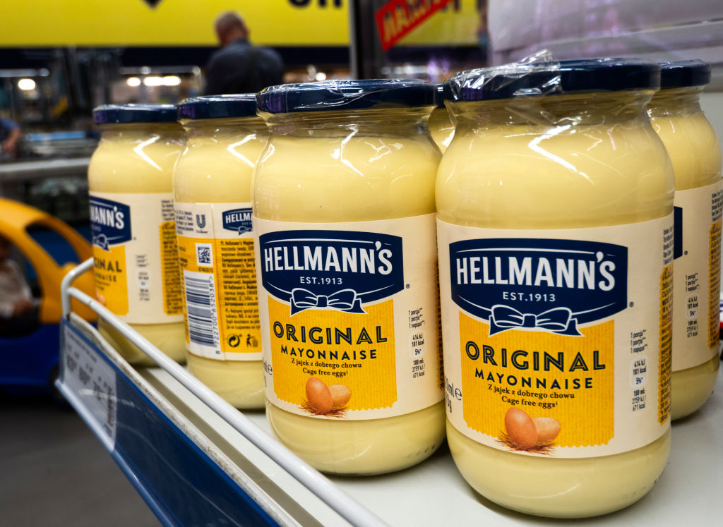 Hellmann's jars of mayonnaise seen on a shelf at a store...