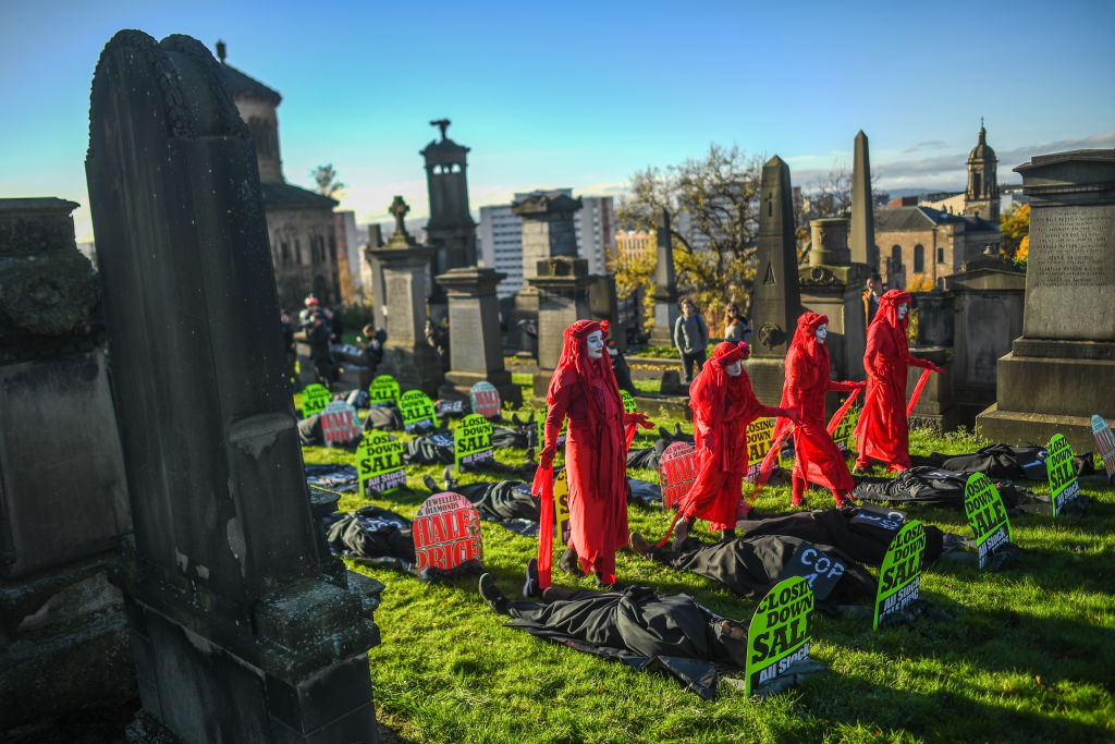 Extinction Rebellion activists are seen holding a Funeral for COP26 at the Necropolis on November 13, 2021 in Glasgow, United Kingdom. (Photo by Peter Summers/Getty Images)