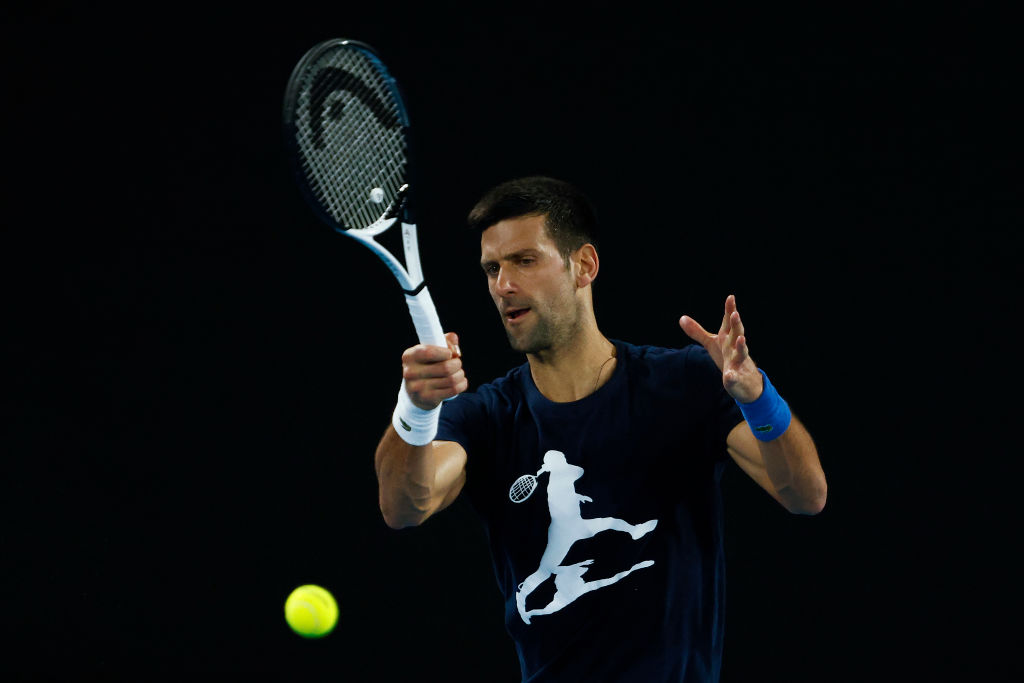 MELBOURNE, AUSTRALIA - JANUARY 14: Novak Djokovic of Serbia plays a forehand during a practice session ahead of the 2022 Australian Open at Melbourne Park on January 14, 2022 in Melbourne, Australia. (Photo by Daniel Pockett/Getty Images)
