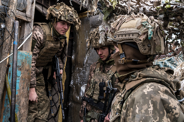 Ukrainian soldiers stand in a trench near the front line in the village of Novhorodske, Ukraine. UK defence secretary Ben Wallace is not optimistic an invasion of Ukraine by Russia can be stopped (Photo by Brendan Hoffman/Getty Images)