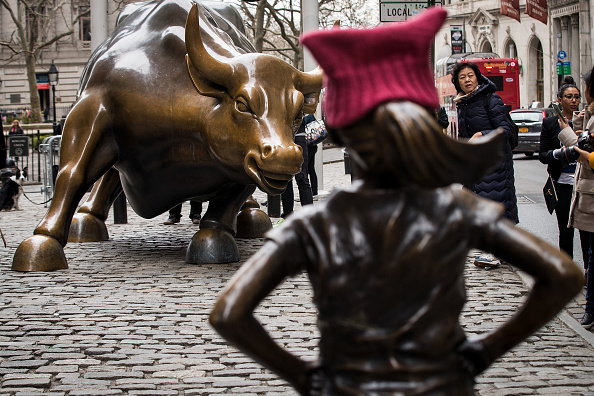 Statue Of Defiant Girl Installed In Front Of Iconic Wall Street Bull By Global Investment Firm