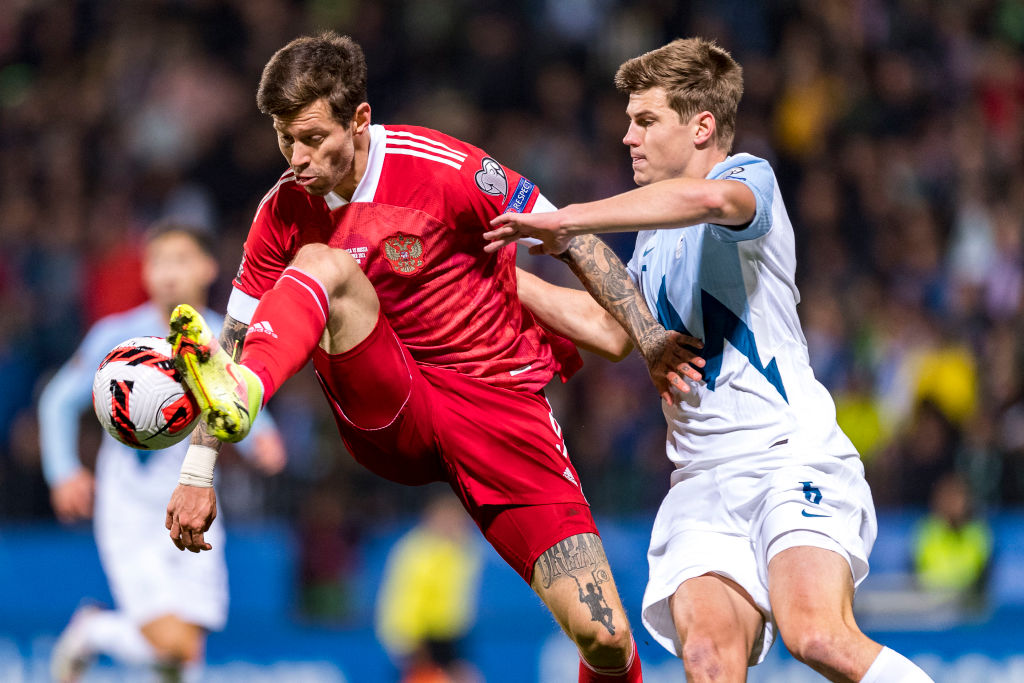 Fifa has imposed sanctions on Russia (left) but has so far refused to expel them from the World Cup, despite Poland and other countries refusing to face them