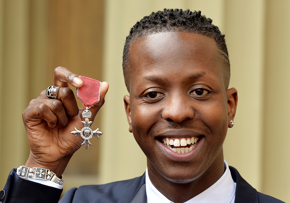 LONDON, ENGLAND - MARCH 26:  Jamal Edwards holds his Member of the British Empire (MBE), after it was awarded to him by the Prince of Wales at an Investiture Ceremony at Buckingham Palace on March 26, 2015 in London, England.  (Photo by John Stillwell - WPA Pool/Getty Images)