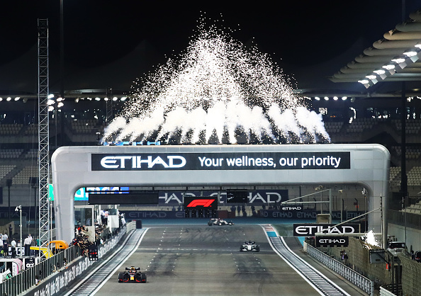 ABU DHABI, UNITED ARAB EMIRATES - DECEMBER 13: Race winner Max Verstappen of the Netherlands driving the (33) Aston Martin Red Bull Racing RB16 takes the chequered flag during the F1 Grand Prix of Abu Dhabi at Yas Marina Circuit on December 13, 2020 in Abu Dhabi, United Arab Emirates. (Photo by Bryn Lennon/Getty Images)