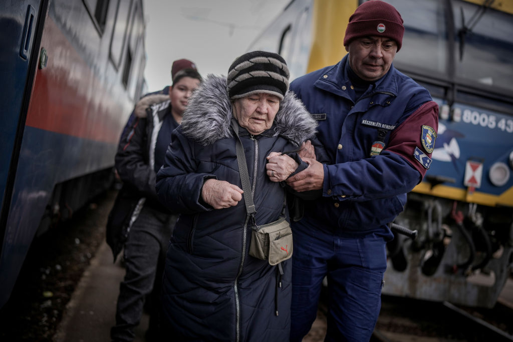ZAHONY, HUNGARY - MARCH 08: Refugees fleeing Ukraine arrive at the border train station of Zahony on March 08, 2022 in Zahony, Hungary. More than 2 million refugees have fled Ukraine since the start of Russia's military offensive, according to the UN. Hungary, one of Ukraine's neighbouring countries, has welcomed more than 144,000 refugees fleeing Ukraine after Russia began a large-scale attack on Ukraine on February 24. (Photo by Christopher Furlong/Getty Images)