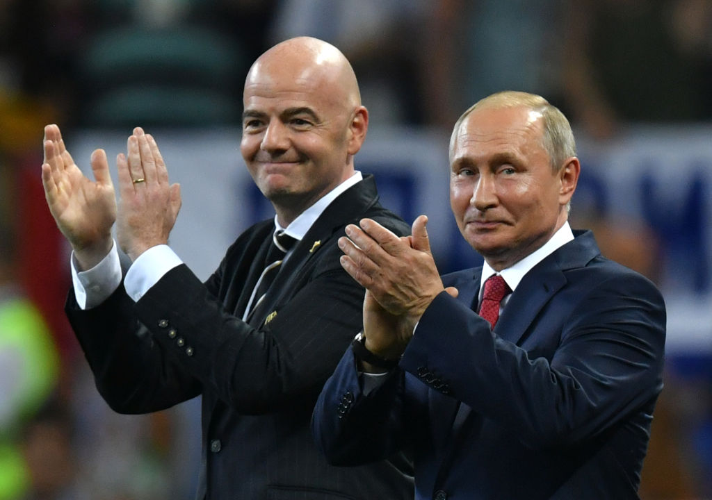 MOSCOW, RUSSIA - JULY 15:  FIFA president Gianni Infantino and President of Russia Vladimir Putin applaud the players on stage following the 2018 FIFA World Cup Final between France and Croatia at Luzhniki Stadium on July 15, 2018 in Moscow, Russia.  