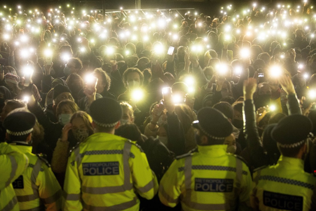 Photo dated 13/03/21 of people in the crowd turning on their phone torches in Clapham Common, London, for a vigil for Sarah Everard. 
