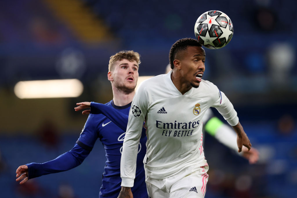 LONDON, ENGLAND - MAY 05: Eder Militao of Real Madrid jumps for the ball with Timo Werner of Chelsea during the UEFA Champions League Semi Final Second Leg match between Chelsea and Real Madrid at Stamford Bridge on May 05, 2021 in London, England. Sporting stadiums around Europe remain under strict restrictions due to the Coronavirus Pandemic as Government social distancing laws prohibit fans inside venues resulting in games being played behind closed doors. (Photo by Clive Rose/Getty Images)