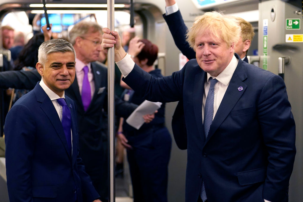 Prime Minister Boris Johnson (R) and Mayor of London Sadiq Khan stand in the carriage of an 'Elizabeth Line' train to mark the completion of London's Crossrail project at Paddington Station, earlier this month.