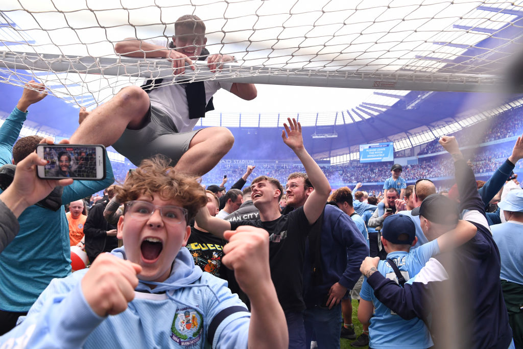 Manchester City fans took part in a pitch invasion after the football club won the Premier League on Sunday