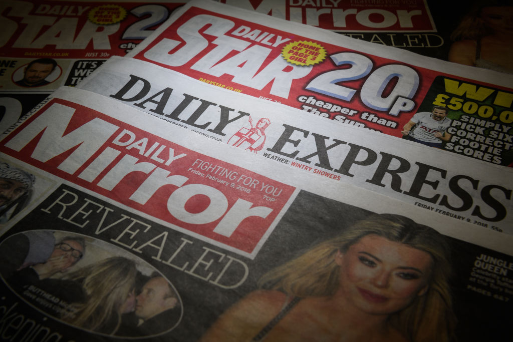 LONDON, ENGLAND - FEBRUARY 09:  Issues of the Daily Mirror, Daily Star and Daily Express are seen on February 9, 2018 in London, England.  The Trinity Mirror media group has agreed to pay £126.7m for Northern & Shell, the media company which publishes the Express and Star newspapers, as well as magazines OK!, New! and Star.  (Photo Illustration by Leon Neal/Getty Images)