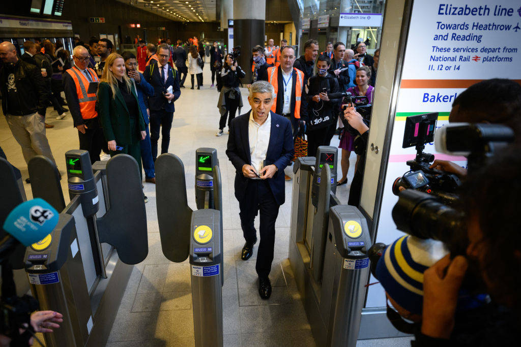 Mayor of London Sadiq Khan passes through the ticket barrier as he prepares to travel on the first eastbound train on the Elizabeth Line. (Photo by Leon Neal/Getty Images)