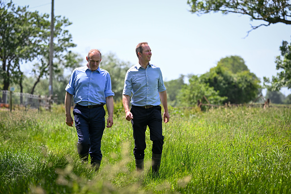 AXMINSTER, ENGLAND - JUNE 10: Liberal Democrat leader Ed Davey with Liberal Democrat candidate for the Tiverton and Honiton by-election Richard Foord walk on a public footpath to test the levels of phosphate in the water in the River Axe, on June 10, 2022 in Axminster, England.The Tiverton and Honiton Constituency by-election is due to be held on 23 June 2022 after Conservative MP Neil Parish resigned following an admission that he viewed pornography on his mobile phone in the Chamber of the House of Commons.  (Photo by Finnbarr Webster/Getty Images)