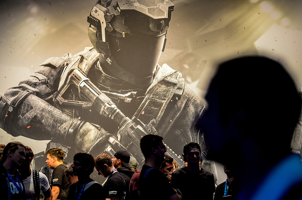GERMANY - AUGUST 17:  Visitors stands in front of the "Call of Duty" stand at the Gamescom 2016 gaming trade fair during the media day on August 17, 2016 in Cologne, Germany. Gamescom is the world's largest digital gaming trade fair and will be open to the public from August 18-21. (Photo by Sascha Schuermann/Getty Images)