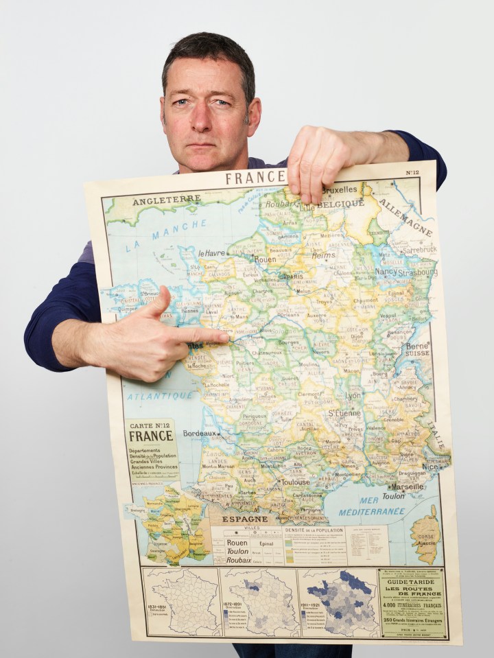 Ned Boulting holding a map of France ahead of the Tour de France