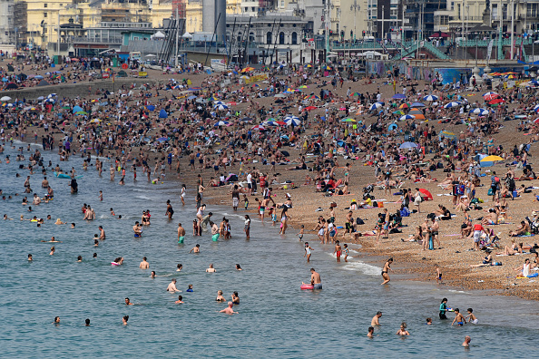 Brighton beach is packed as the UK basks in a summer heatwave