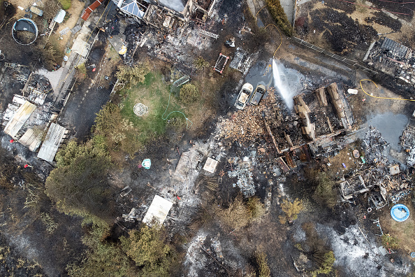 WENNINGTON, GREATER LONDON - JULY 20: An aerial view shows the rubble and destruction in a residential area following a large blaze the previous day, on July 20, 2022 in Wennington, Greater London. A series of fires broke out across England yesterday as the UK experienced a record-breaking heatwave. Temperatures in many places reached 40c and over. (Photo by Leon Neal/Getty Images)