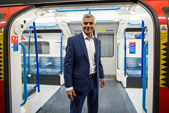 LONDON, ENGLAND - AUGUST 20: London Mayor Sadiq Khan poses in front of the open doors of a train car during the first Night Tube train to leave from Brixton Underground Station on August 20, 2016 in London, England. The London Underground's 24-hour service begins for the first time in its 153 year history. The new Night Tube will see both the Victoria and Central lines run through the night on Fridays and Saturdays. (Photo by Jack Taylor/Getty Images)