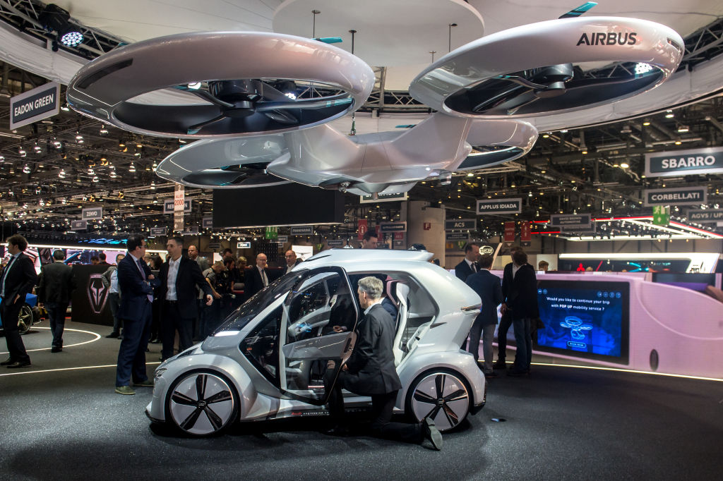 GENEVA, SWITZERLAND - MARCH 06: The 'Pop.up next' concept flying car, a hybrid vehicle that blends a self-driving car and passenger drone by Audi, italdesign and Airbus is seen at the 88th Geneva International Motor Show on March 6, 2018 in Geneva, Switzerland. Global automakers are converging on the show as many seek to roll out viable, mass-production alternatives to the traditional combustion engine, especially in the form of electric cars. The Geneva auto show is also the premiere venue for luxury sports cars and imaginative prototypes. (Photo by Robert Hradil/Getty Images)