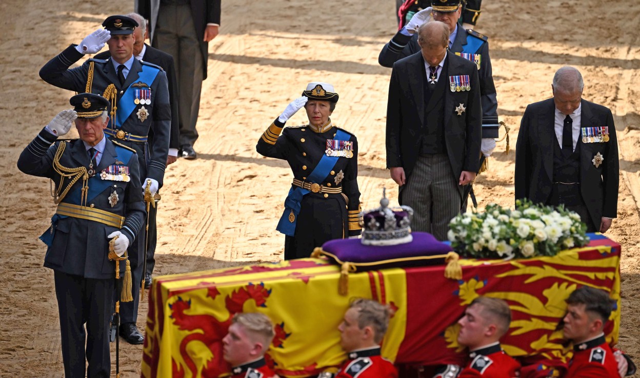  King Charles III, Prince William, Prince of Wales, Princess Anne, Princess Royal, Prince Harry, Duke of York and Prince Andrew, Duke of York follow the coffin of Queen Elizabeth II, adorned with a Royal Standard and the Imperial State Crown, arrives at the Palace of Westminster, following a procession from Buckingham Palace  . (Photo by Ben Stansall - WPA Pool/Getty Images)