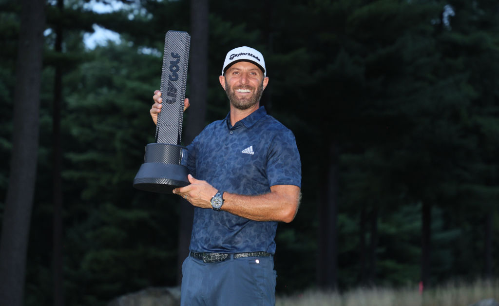 Dustin Johnson of the the United States holds the winner's trophy after winning the LIV Golf Invitational - Boston at The Oaks golf course at The International on September 04, 2022 in Bolton, Massachusetts. 