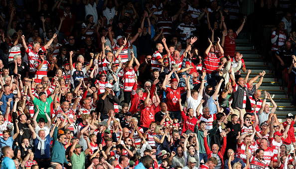 GLOUCESTER, ENGLAND - SEPTEMBER 11:   Gloucester fans celebrate victory at the final whistle during the Gallagher Premiership Rugby match between Gloucester Rugby and Wasps at Kingsholm Stadium on September 11, 2022 in Gloucester, England. (Photo by David Rogers/Getty Images)
