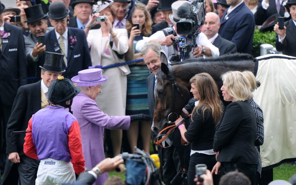 Queen Elizabeth II congratulates her horse Estimate following Gold Cup win at Ascot Racecourse on June 20, 2013 in Ascot, England.