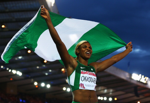 GLASGOW, SCOTLAND - JULY 28:  Blessing Okagbare of Nigeria celebrates winning gold in the Women's 100 metres final at Hampden Park during day five of the Glasgow 2014 Commonwealth Games on July 28, 2014 in Glasgow, United Kingdom.  (Photo by Cameron Spencer/Getty Images)