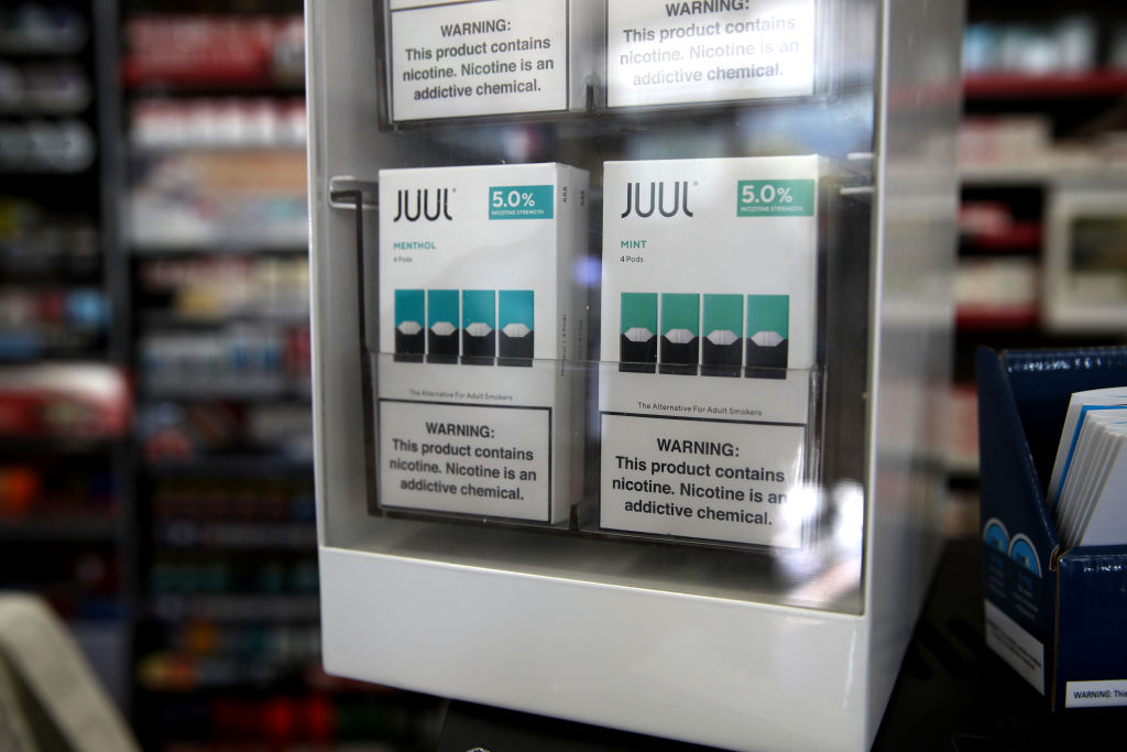 SAN RAFAEL, CALIFORNIA - NOVEMBER 07:  Packages of Juul mint flavored e-cigarettes are displayed at San Rafael Smokeshop on November 07, 2019 in San Rafael, California. Juul, a leading e-cigarette company, announced that it is halting sales of their popular mint flavor e-cigarette after the release of two studies that showed a surge in teen use.  (Photo by Justin Sullivan/Getty Images)