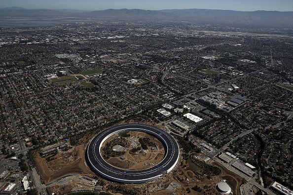 CUPERTINO, CA - APRIL 28:  An aerial view of the new Apple headquarters on April 28, 2017 in Cupertino, California. Apple's new 175-acre 'spaceship' campus dubbed "Apple Park" is nearing completion and is set to begin moving in Apple employees. The new headquarters, designed by Lord Norman Foster and costing roughly $5 billion, will house 13,000 employees in over 2.8 million square feet of office space and will have nearly 80 acres of parking to accommodate 11,000 cars.  (Photo by Justin Sullivan/Getty Images)