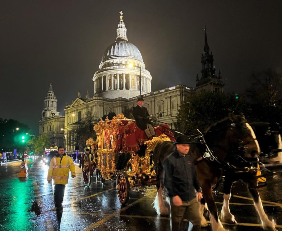 Horse-drawn golden state carriage passes St Paul's 