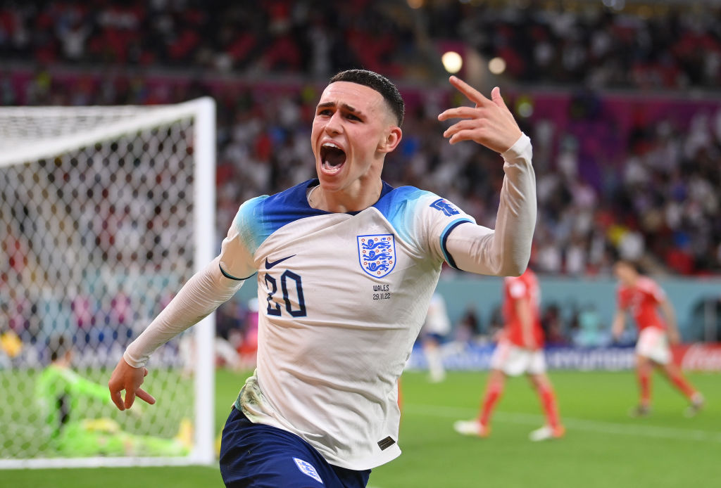 DOHA, QATAR - NOVEMBER 29: Phil Foden of England celebrates after scoring their team's second goal during the FIFA World Cup Qatar 2022 Group B match between Wales and England at Ahmad Bin Ali Stadium on November 29, 2022 in Doha, Qatar. (Photo by Laurence Griffiths/Getty Images)