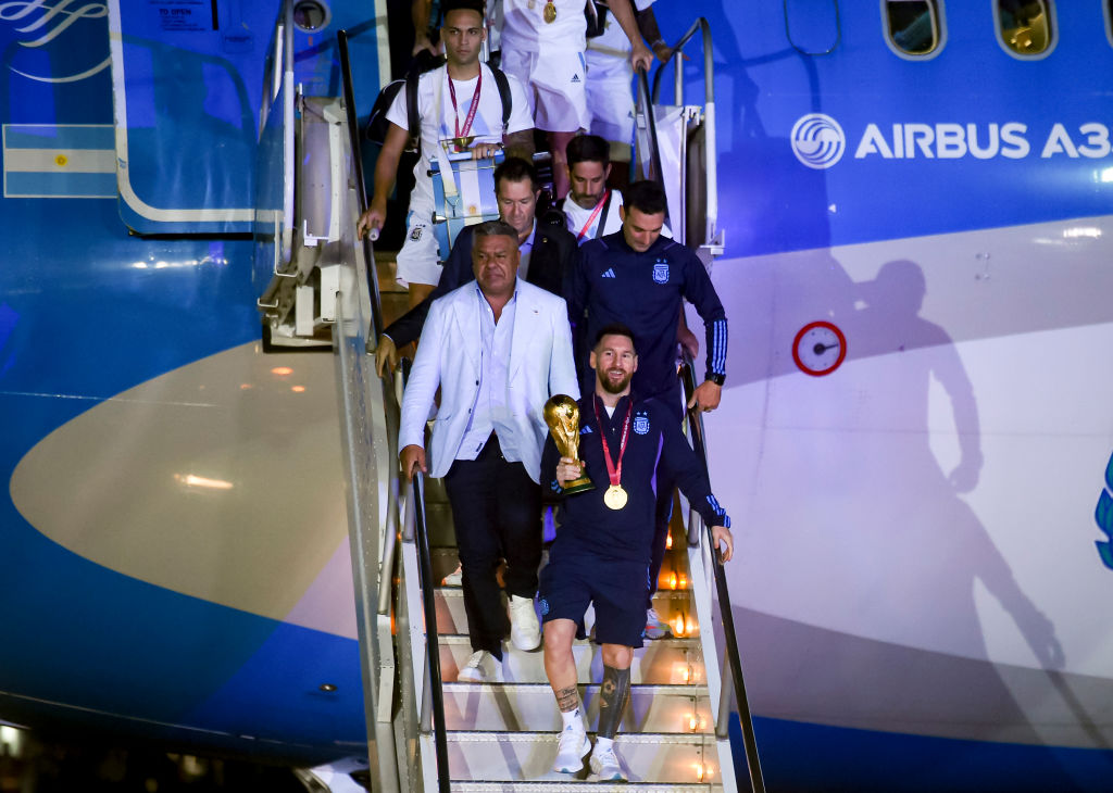 Argentina squad, including Lionel Messi, land home from the World Cup.